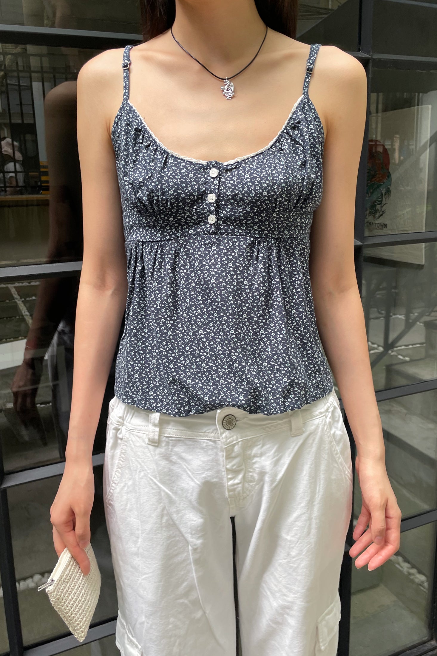 Hi! I'm currently looking for the Brandy Melville Tiffany Button Up tank.  It is so cute but I can not find the exact design for sale anywhere! Some  photos for reference: 